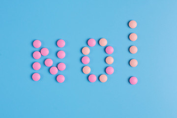 No! Composed of pink pills on a blue background