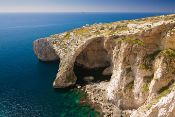 Malta - Qrendi - Dramatic massive natural stone arch Blue Grotto (Taht il-Hnejja) near Wied...