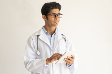 Portrait of smiling doctor with tablet computer