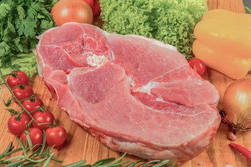 Juicy raw meat, beef entrecote on black background, top view