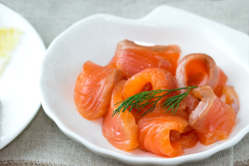 Sliced trout on a plate.