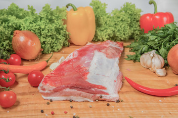 Juicy raw meat, beef entrecote on black background, top view