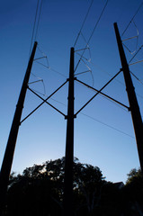 Twilight view power lines insulators fly over bridge construction site hilton head 