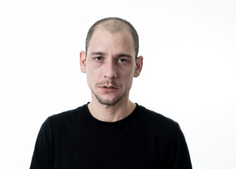 Obraz premium Close up portrait of sad young man face suffering from depression, stress and unhappiness.