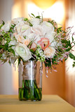 a bridal wedding bouquet in a glass jar before the wedding ceremony, White and pink flowers