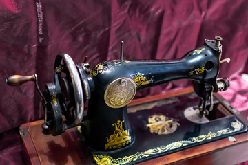 old Sewing machine  in red background