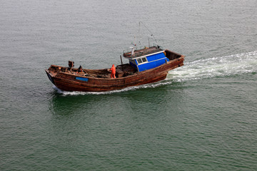 fishing boat driving in the sea