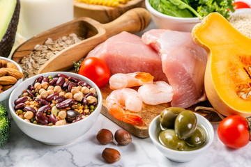 Mediterranean diet concept - meat, fish, fruits and vegetables on bright green background