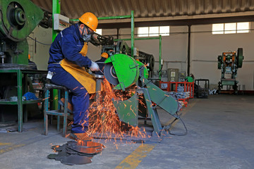 workers in the steel spade production line, in a factory, Tangshan City, Hebei, China