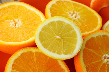 background of cut oranges and a lemon