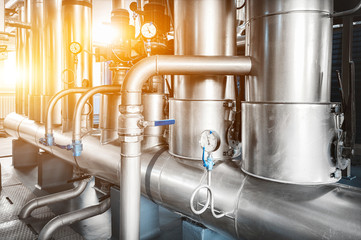 pipe line with pressure gauges installed in the boiler room with backlight illumination