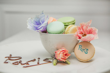 sweet french macaroon on white isolated white background. fly falling sweet macaroni