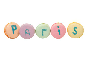 colorful macaroons, almond cookies, with the help of macaroons lined the word Paris