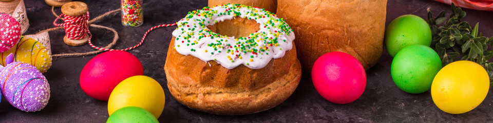 Easter cake and Easter eggs, traditional holiday attributes (Happy Easter!). food background. top view