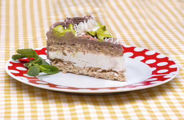 Piece of chocolate cake with warm fudge sauce.