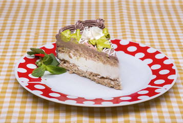 Piece of chocolate cake with warm fudge sauce.