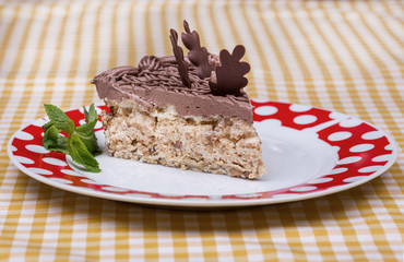 Piece of chocolate cake with warm fudge sauce.