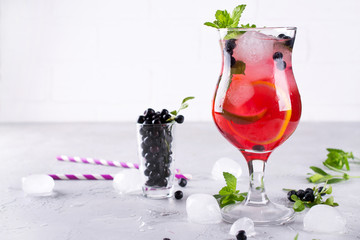 Summer cold drink with blueberry, mint lemon and ice in glass