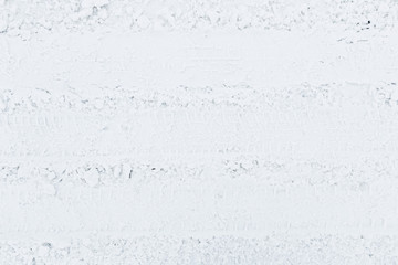 Car traces on the road in winter. Background