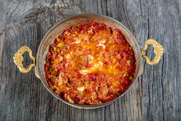 Traditional turkish food menemen made by eggs and tomatoes.