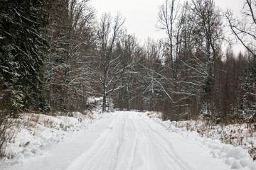 deep snow covered road in winter