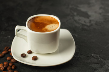 coffee freshly brewed in a white cup serving of beverage (coffee grain). food. top.copy save