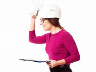 Emotional girl brigadier in a white helmet with glasses and a folder in his hands on a white background