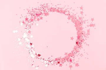 Festive pink background. Shining stars on light pink pastel background. Christmas. Wedding....