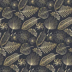 Behang Elegant naadloos patroon met overzichts gouden tropische bladeren en bloemen op donkerblauwe achtergrond. Trendy exotische plantentextuur voor textiel, inpakpapier, oppervlak, behang, achtergrond © Tatahnka