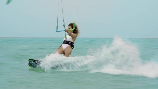 Young girl Kite Surfing In Ocean, Extreme summer sport slow motion