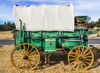Retro Covered Wagon With Weathered Wheels