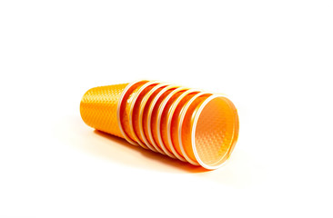 Orange Plastic Cups are stacked one by one