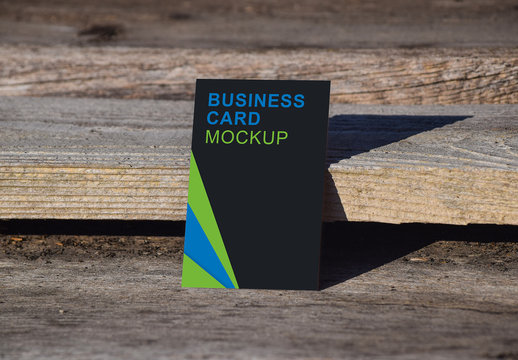 Vertical Business Card on Wood Background Mockup