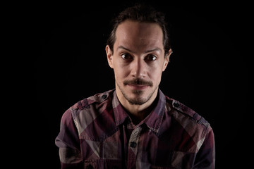 closeup portrait of a young man with back background and copy space