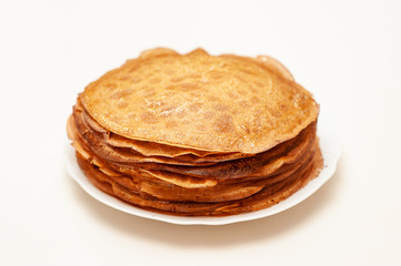Pancakes on the white plate.