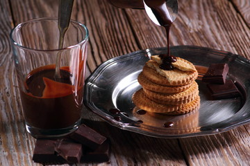 Sweets and desserts, chocolate and biscuits on wooden rustic background