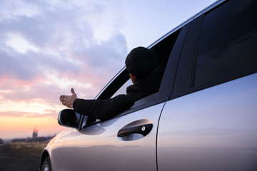 Fototapeta na wymiar angry man hand in car window