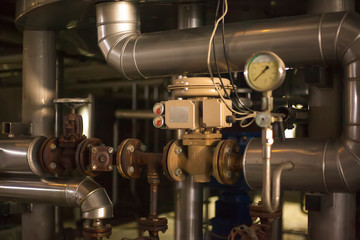 A pressure gauge inside of a beer plant brewery