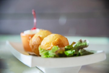Colourful fried ice cream ball dish - fast delicious unhealthy food concept