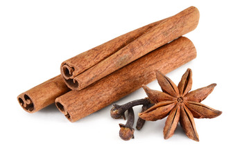 Set spices. Badian, cinnamon and carnation on a white background. Isolated, closeup.