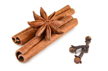 Set spices. Star-anise, cinnamon sticks and buds cloves on a white background. Isolated, closeup.