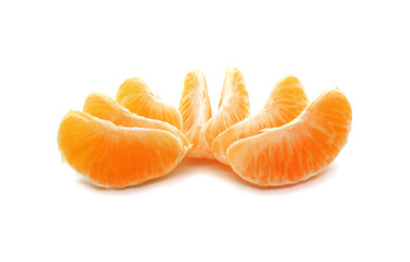 Juicy slices of peeled tangerine isolated on white background.