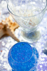 Bright blue balls in the glass vase. Seatime theme on the party's candybar