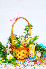 Easter composition. Easter cake and painted eggs, white flowers, festive composition in rustic style,ukrainian orthodox tradition, vintage wooden background, selective focus