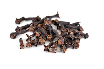 Spice cloves. Carnation. The buds fragrant cloves on a white background, isolated. Shallow depth of field, closeup.