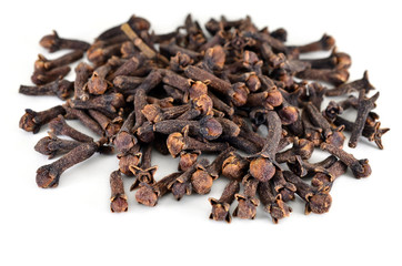 Spice cloves. Carnation. The buds fragrant cloves on a white background, isolated. Shallow depth of field, closeup.