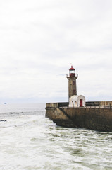 Old stone lighthouse and ocean view in Porto