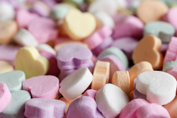 Close up shot of conversation candy hearts.  Valentines Day background.