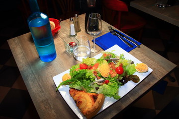 table of a French restaurant with glasses and flatware