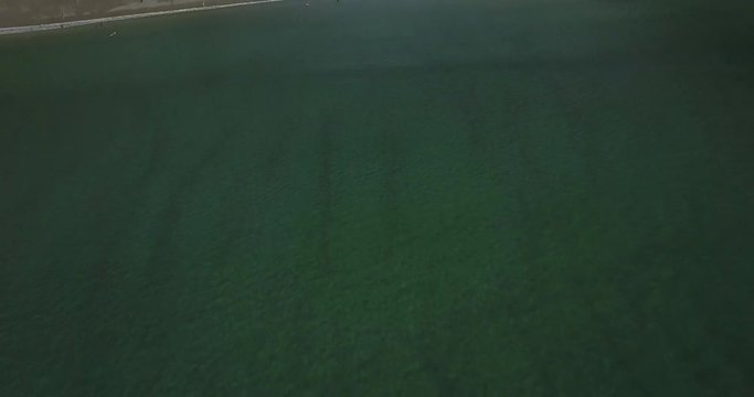 Drone shot of Hoddevik beach over the water. Opening/tilt up shot revealing Hoddevika beach in Sogn og Fjordane.